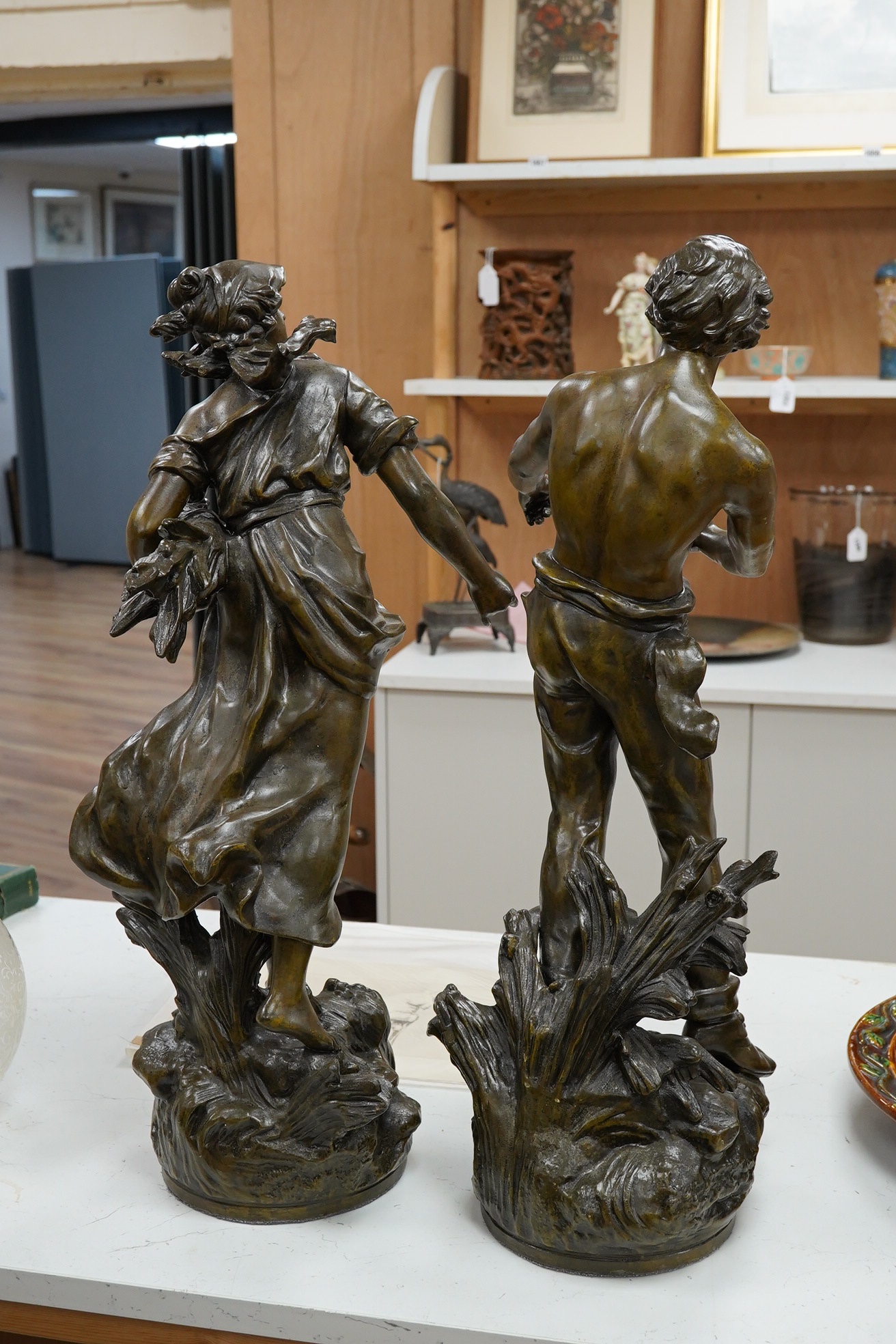 After Auguste Moreau 1861-1906, a pair of spelter figures, 60cm. Condition - fair (pieces missing)